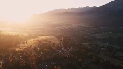 Scenic sunset drone flight above mountain range silhouette aerial view. Stock Footage 164035849