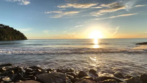 Scenic Sunset Landscape View of Calm Sea Waves on Rocky Beach Stock Footage 345953717
