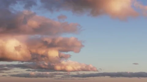 Scenic sunset with orange clouds on blue sky Stock Footage 135501636