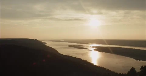 Scenic sunset over river landscape with lens flare Stock Footage 304563055