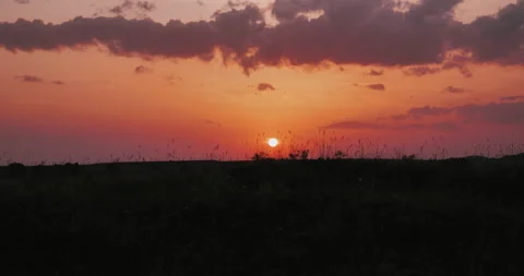 Scenic sunset on the plain. dark sky during the sunset. Stock Footage 157994815