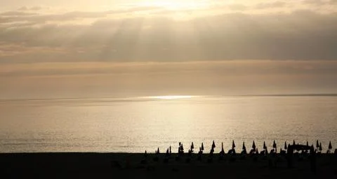 Scenic sunset with sun rays on the beach sardinia italy 스톡 사진