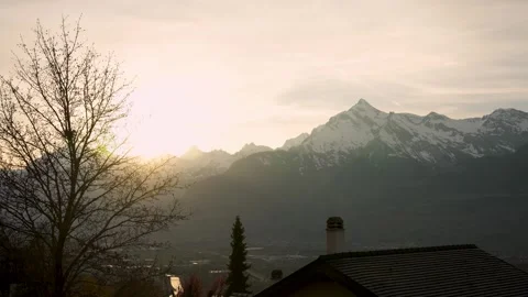 Scenic sunset time-lapse behind Haut de Cry Peak above Sion in Rhône Valley Stock Footage 334365366