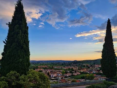 Scenic sunset view over a small town in Tuscany, Italy. Stock Photos
