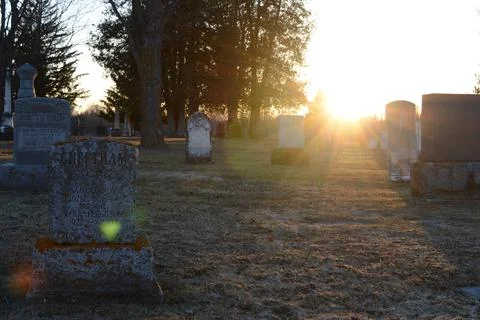 Scenic Sunsetting Graveyard Stock Photos