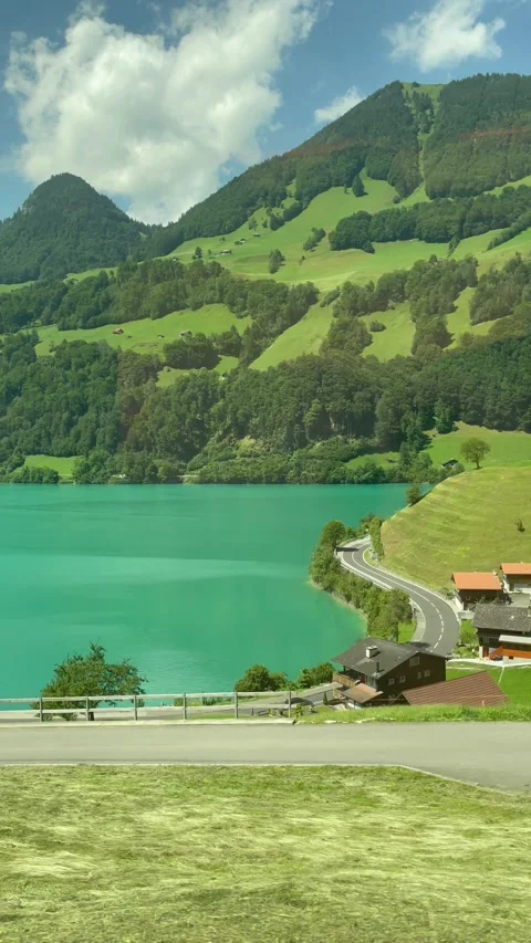 Scenic Swiss landscape view from a train window Video stock 336330102