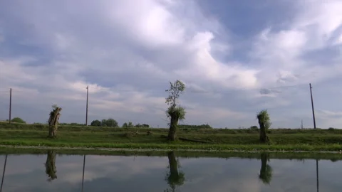 Scenic time lapse from a coast of a small river on a cloudy day Видео 138483191