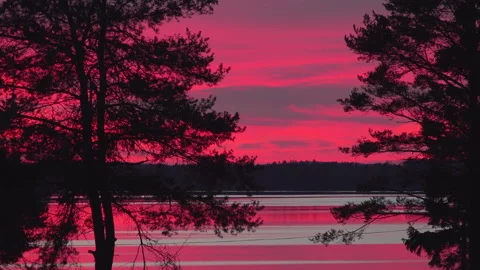 Scenic time lapse video of red orange burning midnight skies after sunset. Stock Footage 154874404