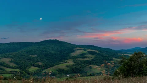 Scenic timelapse of dramatic sky with moon during sunset. Romantic landscape Stock Footage 287457766