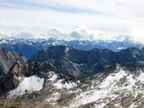 Scenic top view of mountain range and hills covered with snow Stock Photos