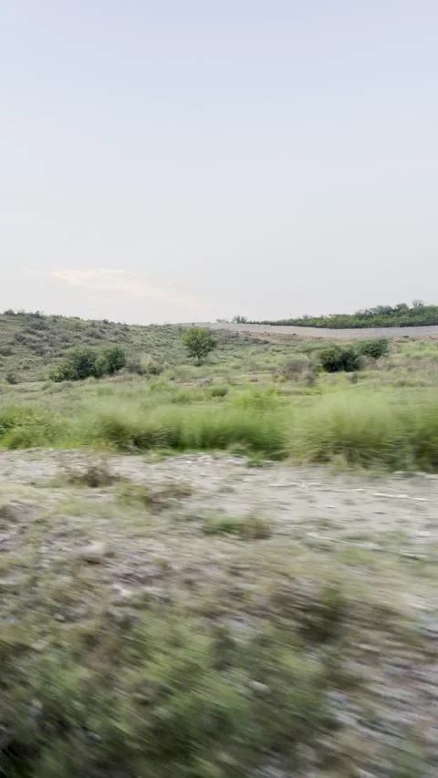 Scenic Train Journey - Window View of Nature &amp; Railway Tracks Stock Footage 309167478