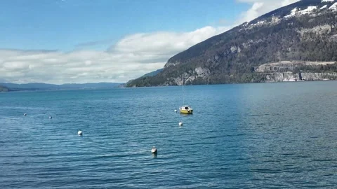 Scenic Train View Along Lake Thun from Interlaken to Zurich Stock Footage 335016675