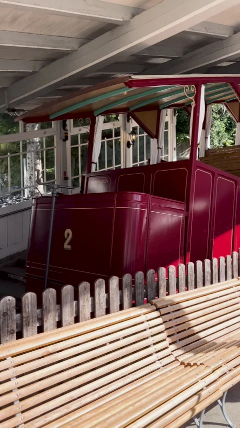 The Scenic Tram Station Features Comfortable Benches and a Vibrant, Colorful Stock Footage 307425174