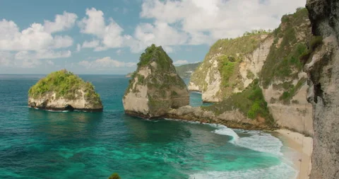Scenic tropical coastline with massive limestone cliffs and turquoise ocean Stock Footage 345689188