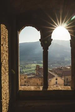 Scenic view from arched stone window in Sperlinga, Sicily at golden hour Stock Photos