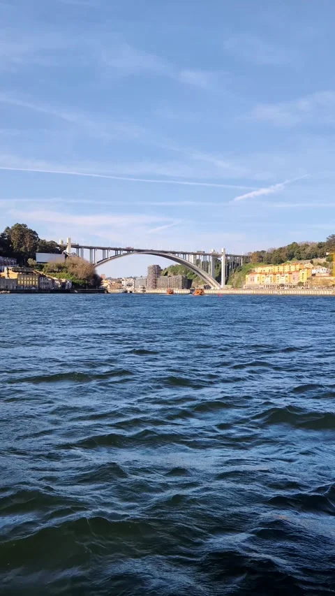 Scenic view of Arrabida bridge over Douro river in Porto, Portugal Video stock 335636722