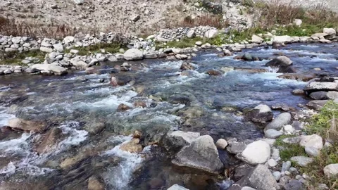 Scenic View A Beautiful Forest River Flowing Rapidly Between Rocky Shores, w Stock Footage 288465657