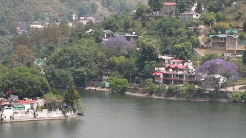 Scenic view of Bhimtal lake surrounded by lush greenery Video stock 334328552