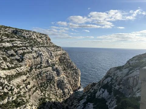 Scenic view of the blue sea between steep limestone cliffs. Stock Photos
