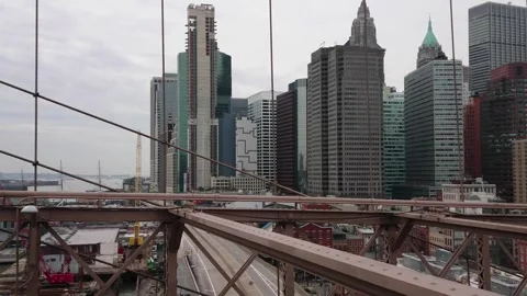 Scenic view from brooklyn bridge over manhattan and ferry boat station Stock Footage 276697448