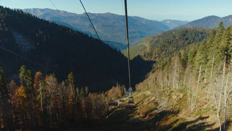 Scenic view from cable car cabin moving down among the autumn colored trees in Stock Footage 204048437