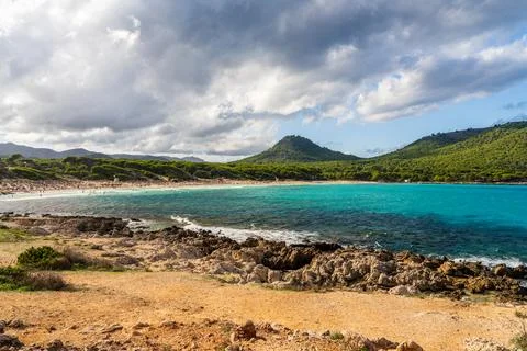 Scenic view of Cala Agulla beach in Mallorca, Spain, with turquoise Mediterra Stock Photos