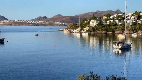 Scenic view of the calm, blue bay in Bitez, Turkey, with luxury boats anchored o Stock Footage 339649746