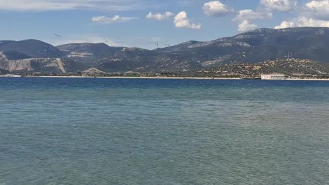 Scenic View of Calm Blue Sea Water with Seagulls and Mountain Coast Stock Footage 346684792