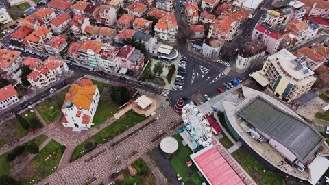 Scenic view of a city intersection with buildings and playground 스톡 동영상 332212643