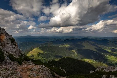 Scenic view with dark, blue, cloudy, sky on valley Stock Photos