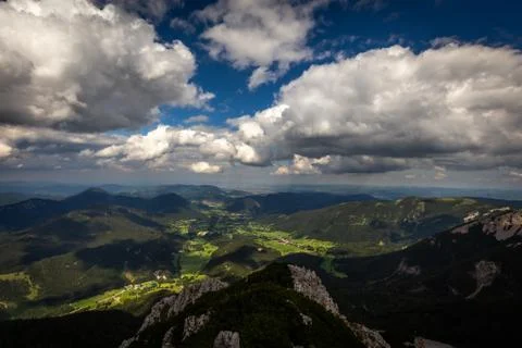 Scenic view with dark, cloudy sky on valley with Puchberg village Stock Photos