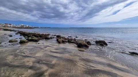 Scenic view on the drainage patterns at Costa Adeje beach on Tenerife, Cana.. Stock Photos