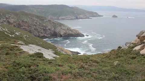 Scenic view of dramatic cliffs and ocean waves from Punta Roncadoira lightho Stock Footage 335109584