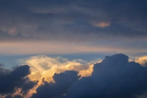 Scenic View of Dramatic Clouds Lit by Sunset. Stock Photos
