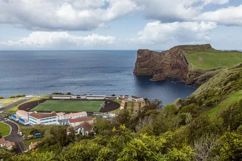 Scenic view of the dramatic coastal cliffs and football field at Faj de Lopo  Stock Photos