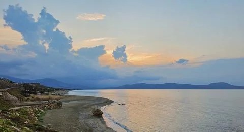 Scenic view of dramatic overcast cloudy sky over tranquil Mediterranean sea.. Stock Photos