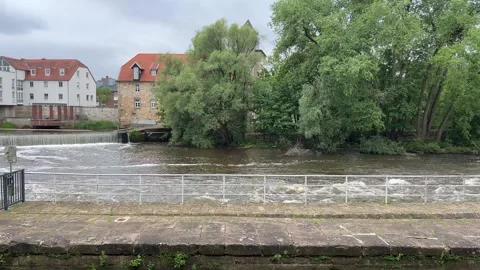 Scenic view of the Ems river weir in Rheine, Germany, with historic buildin.. Stock Footage 337775074