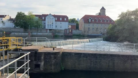 Scenic view of the Ems river weir in Rheine, Germany, featuring historic bu.. Stock Footage 340071352