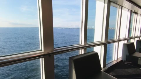 Scenic view from ferry window overlooking calm sea, sunny day Stock Footage 289697752