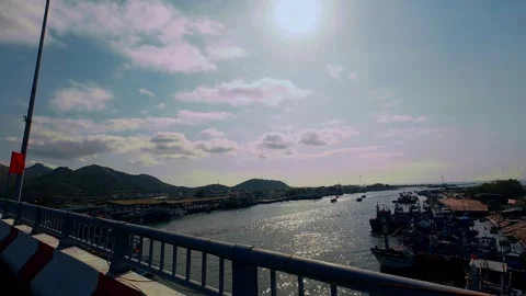 Scenic View of Fishing Harbor from Bridge under Bright Sun Glare Stock Footage 337028126