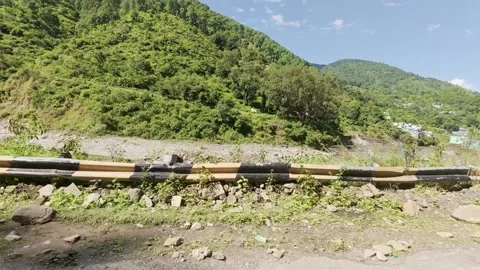 Scenic View of Flowing Himalayan River and Lush Green Mountains in Uttarakhand,  Stock Footage 324793238