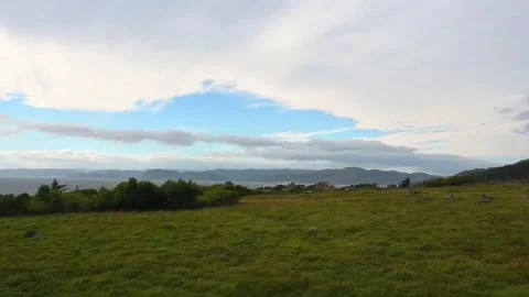 Scenic view of green fields and blue sky in Norway with hills and clouds du.. Stock Footage 340215680