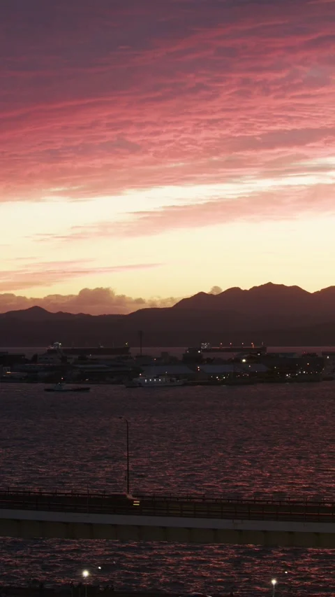 Scenic view of a harbor under a pink sunset sky, Hakodate, Japan,  2026.09.10. 動画素材 345439702
