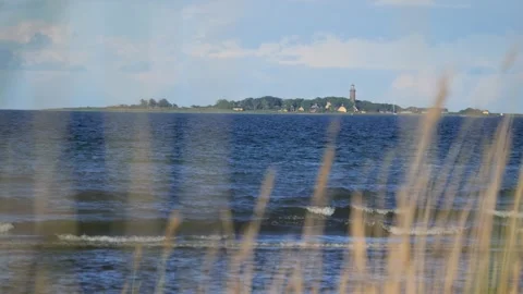Scenic view of hiddensee island and lighthouse from afar Stock-Footage 337740734