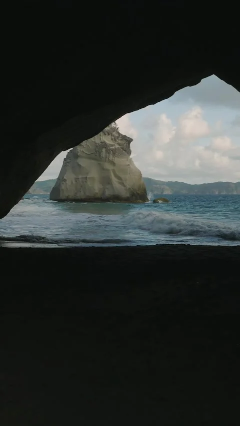 Scenic view from the inside of a cave by the beach in Cathedral Cove. Corom.. Stock Footage 284739389