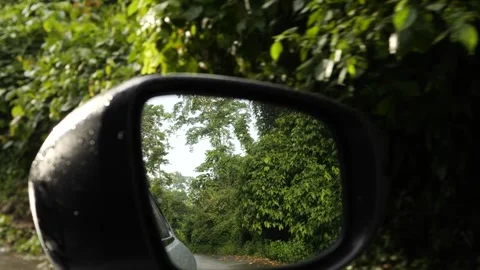 Scenic view of jungle road reflected in side mirror while driving in Thailand. Stock Footage 315263378