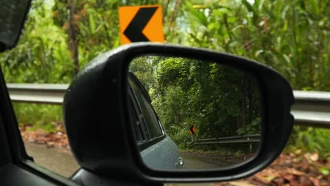 Scenic view of jungle road reflected in side mirror while driving in Thailand. Stock Footage 315263484