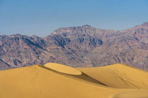 Scenic view of Mesquite Flat Sand Dunes and rocky mountains in desert, Death Stock Photos