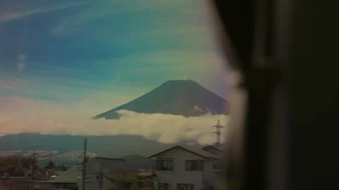 Scenic view of Mount Fuji from a moving train window in Japan Stockbeeldmateriaal 340621226