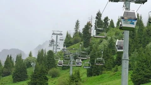 Scenic view of a mountain cable car on a bright summer day Stock Footage 316921913